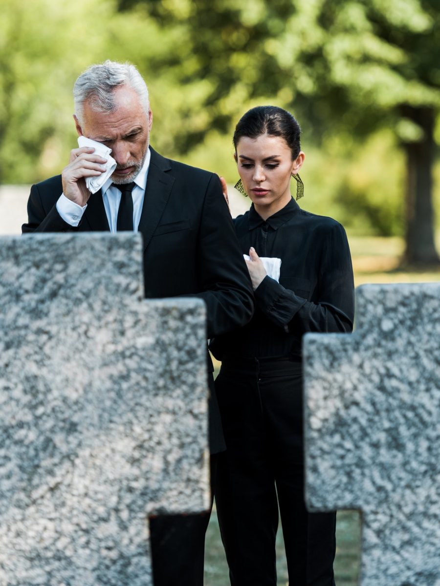 selective-focus-of-upset-man-crying-near-woman-on-funeral.jpg